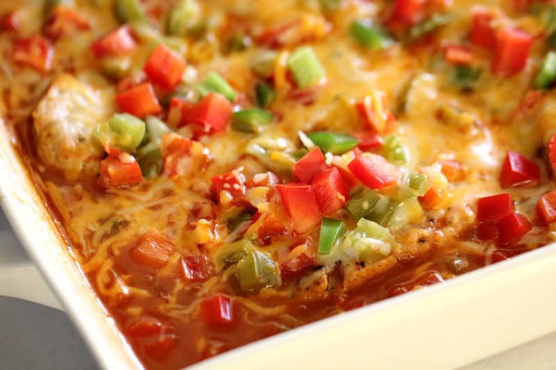 Fiesta Pork Chops and Rice Bake in a white casserole dish