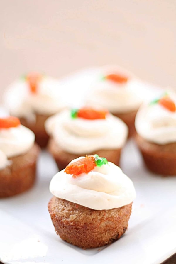 Several Bite Size Carrot Cakes on a cake stand.