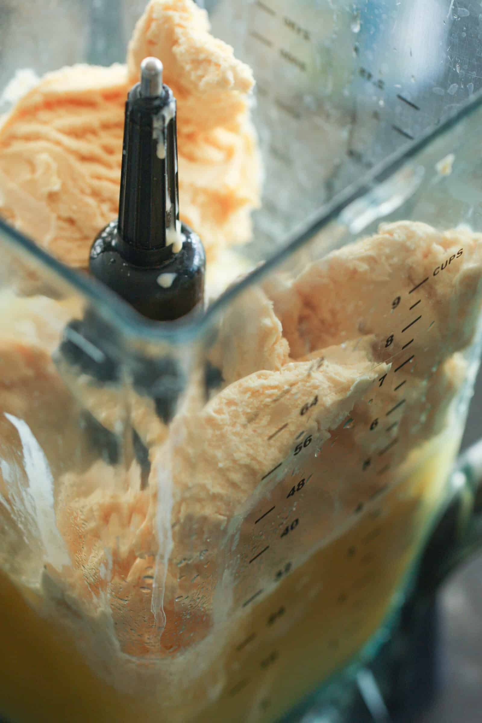 Blender full of ingredients for Piña Colada Fruit Smoothie.