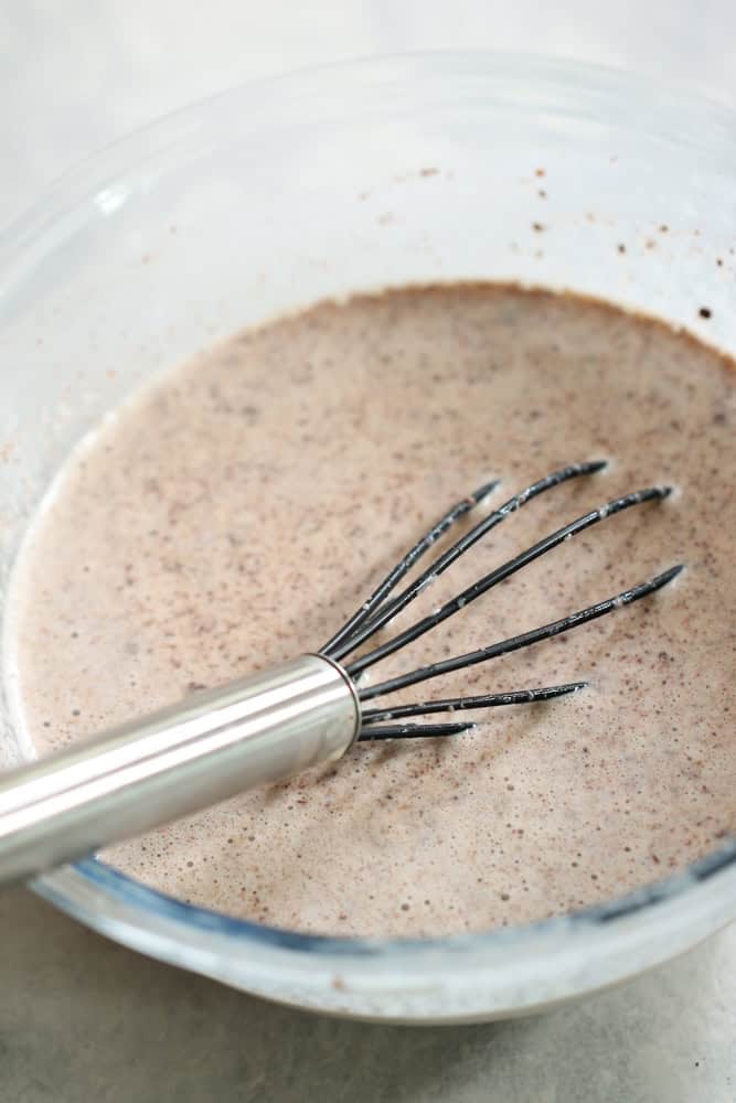 Bowl with a whisk and Homemade French Toast Sticks batter