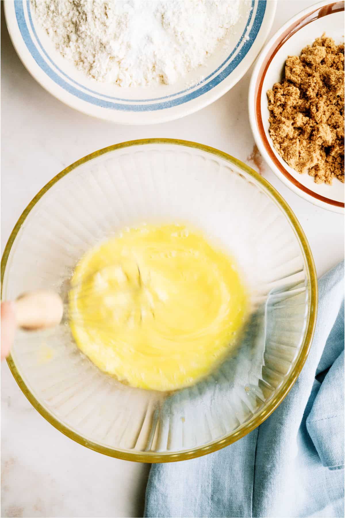 A bowl of butter, flour and topping for Brown Butter Banana Bread