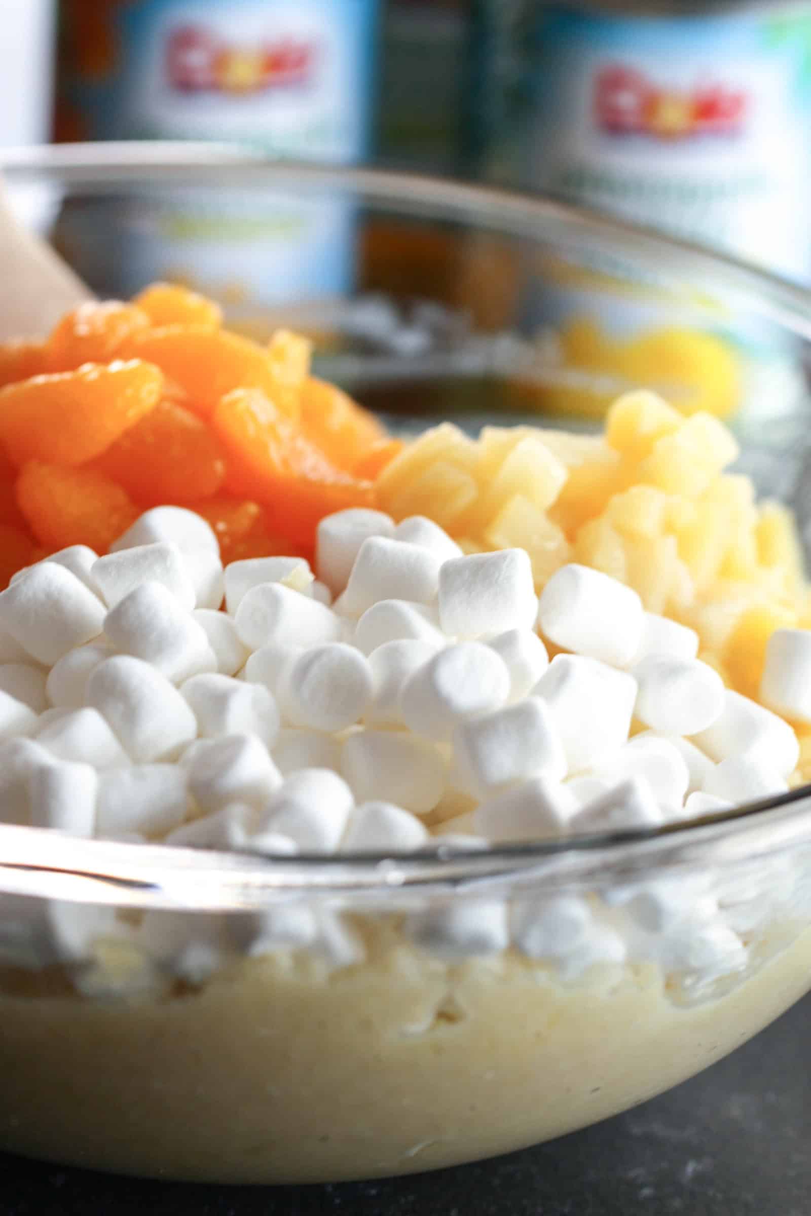 Folding in remaining ingredients in glass bowl