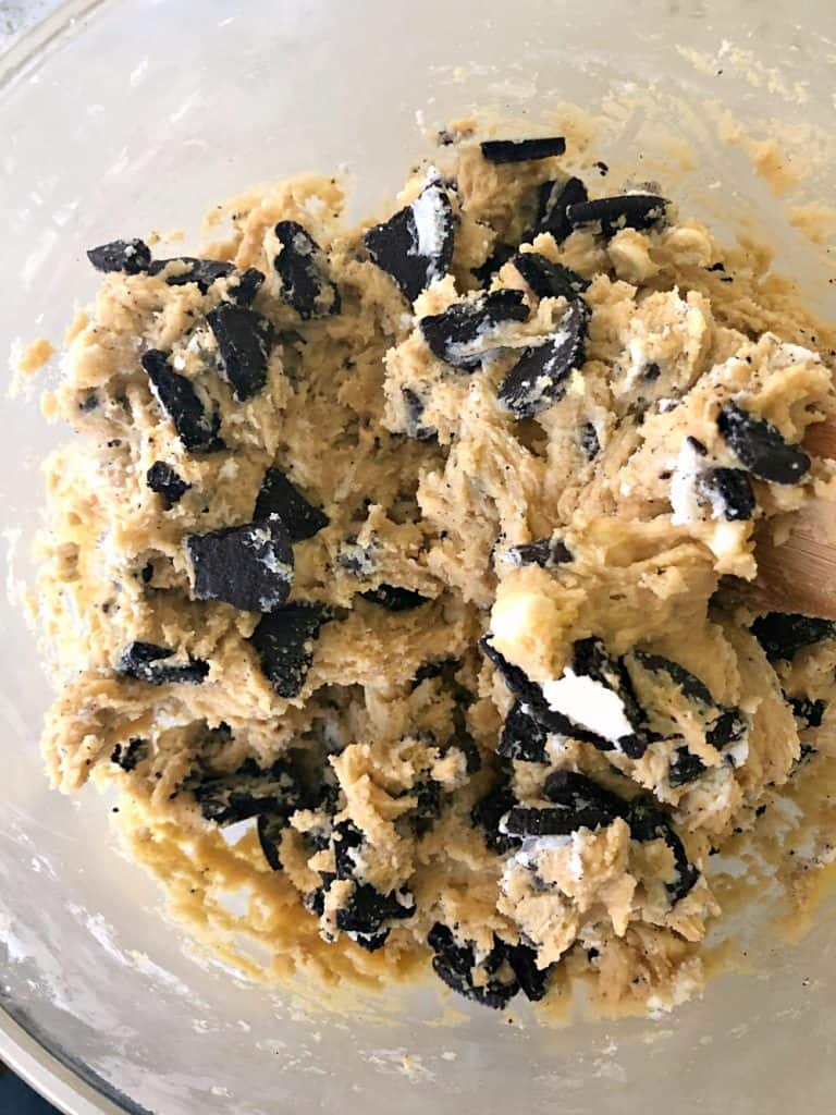 Cookies and Cream Oreo Blondie batter in a glass mixing bowl.
