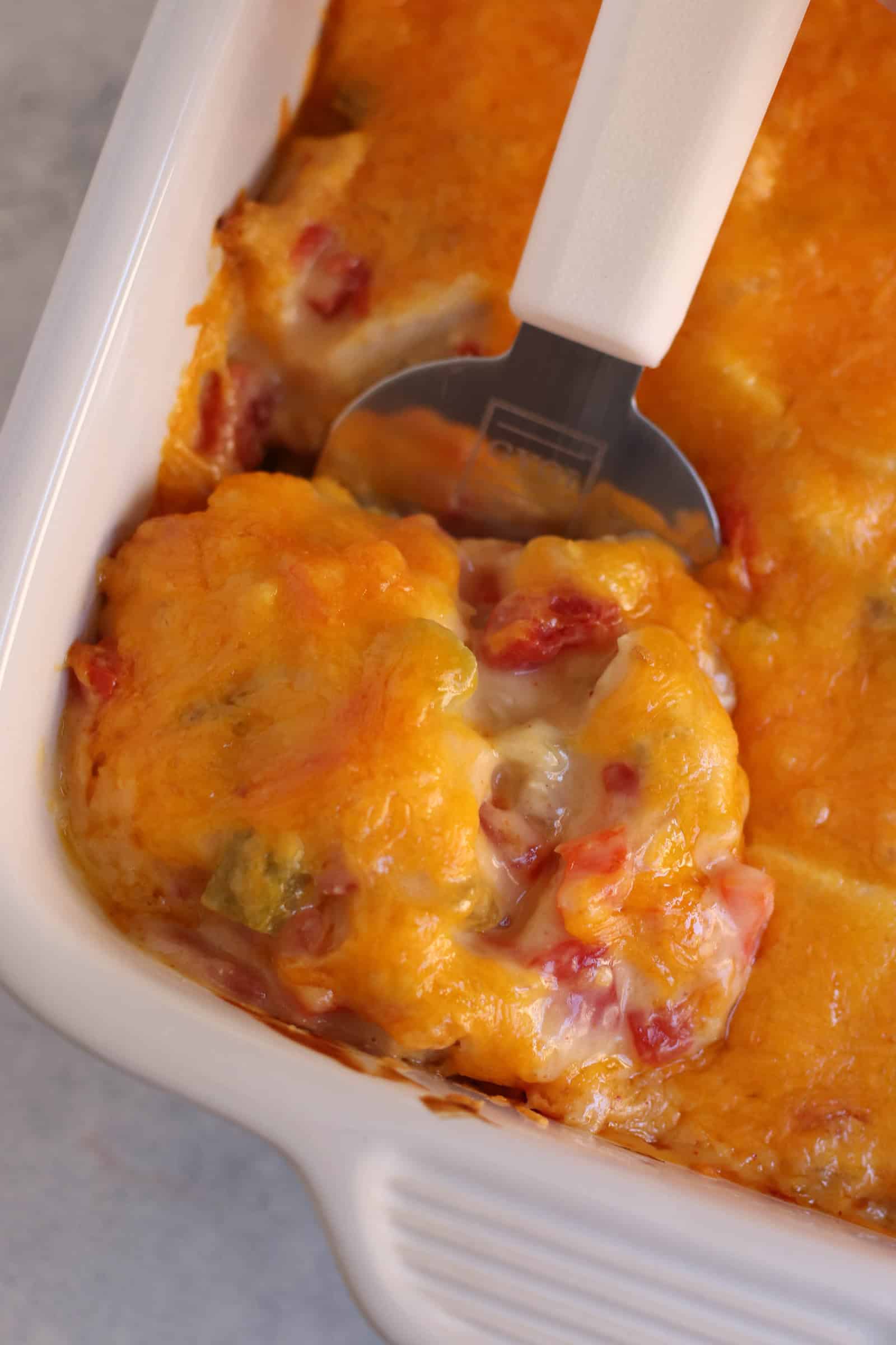 Texas Ranch Chicken Casserole in a casserole dish with a serving utencil