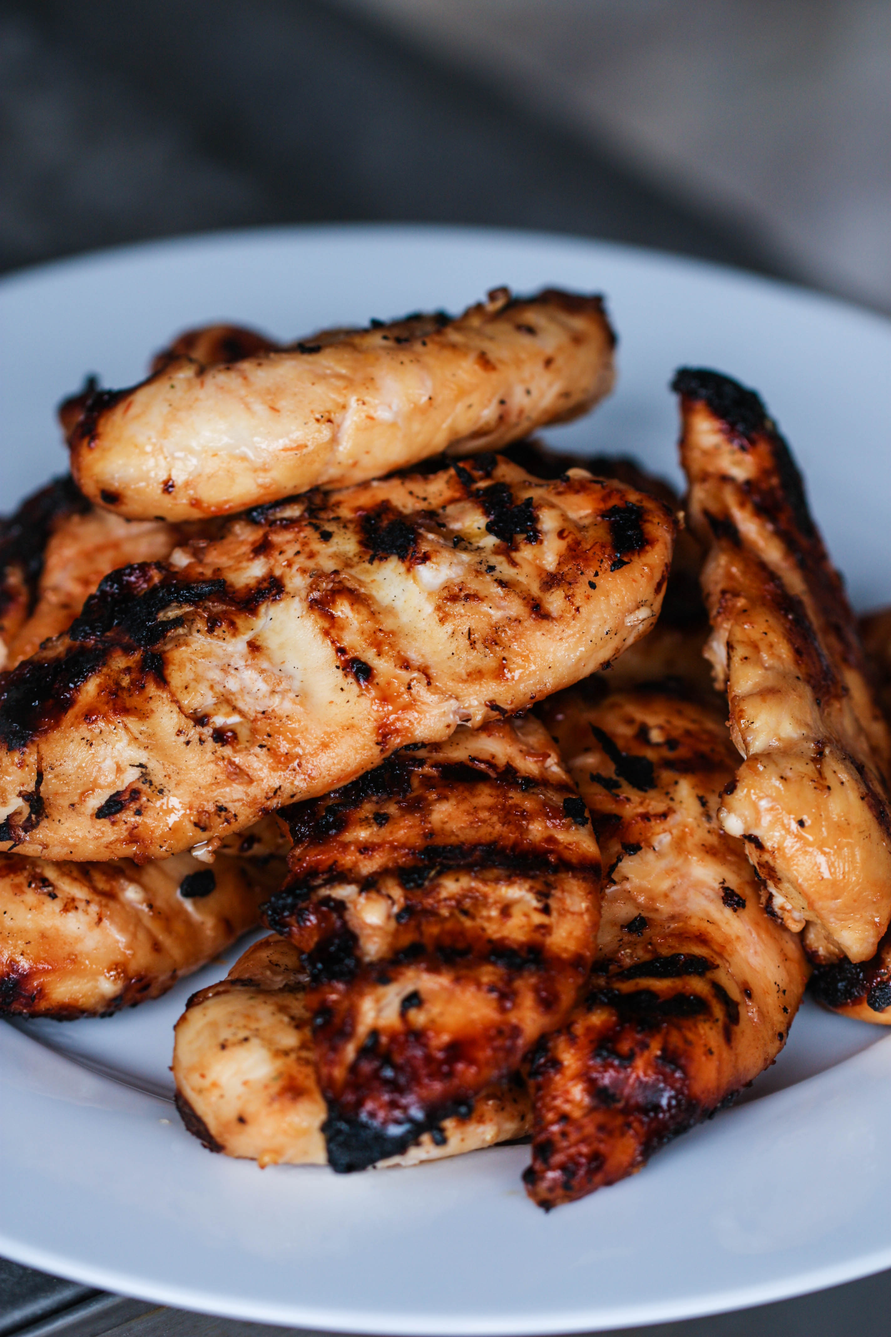 Barbecue Peach Chicken pieces on a white plate