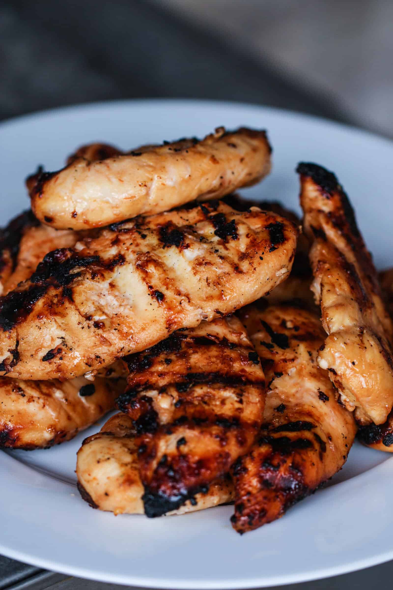 Barbecue Peach Chicken pieces on a white plate