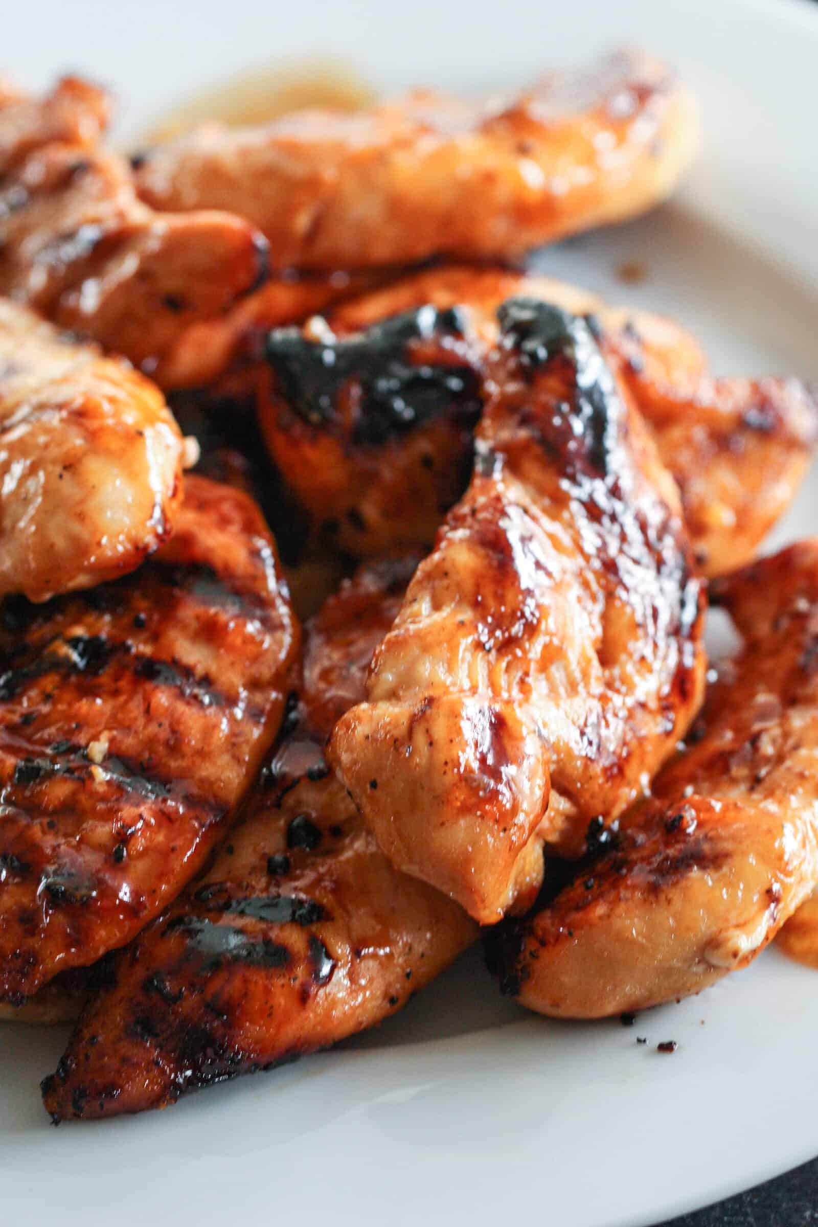 Barbecue Peach Chicken Pieces on a white plate