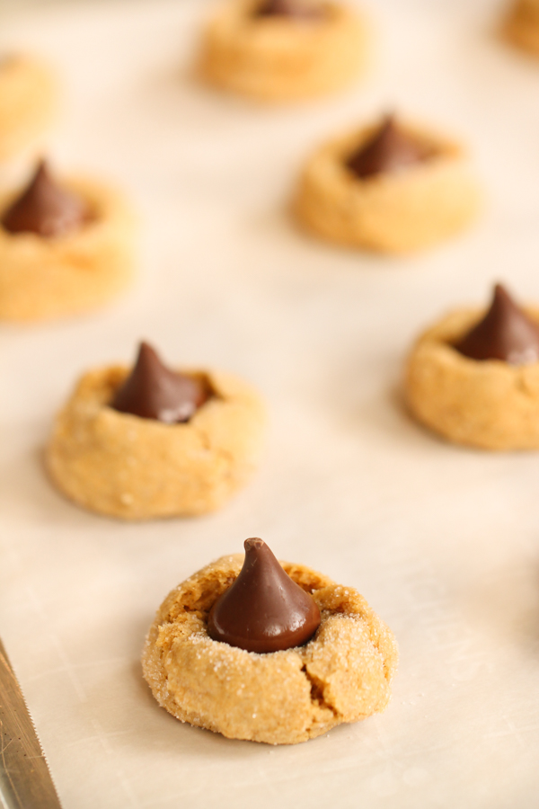 Pumpkin Hershey’s Kiss Cookies Recipe on a baking sheet lined with parchment paper
