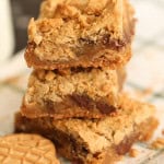 3 Nutter Butter Cookie Bars stacked with a couple Nutter Butter Cookies around them.