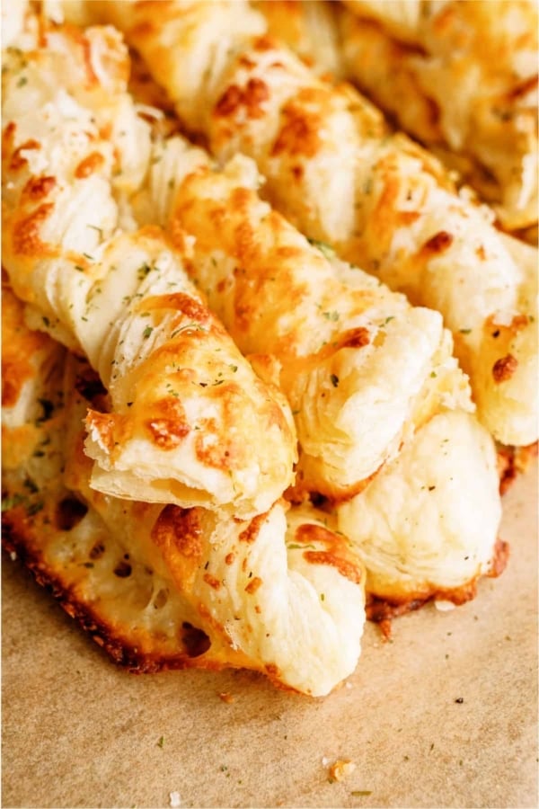 Twisted Cheese Breadsticks in a pile.