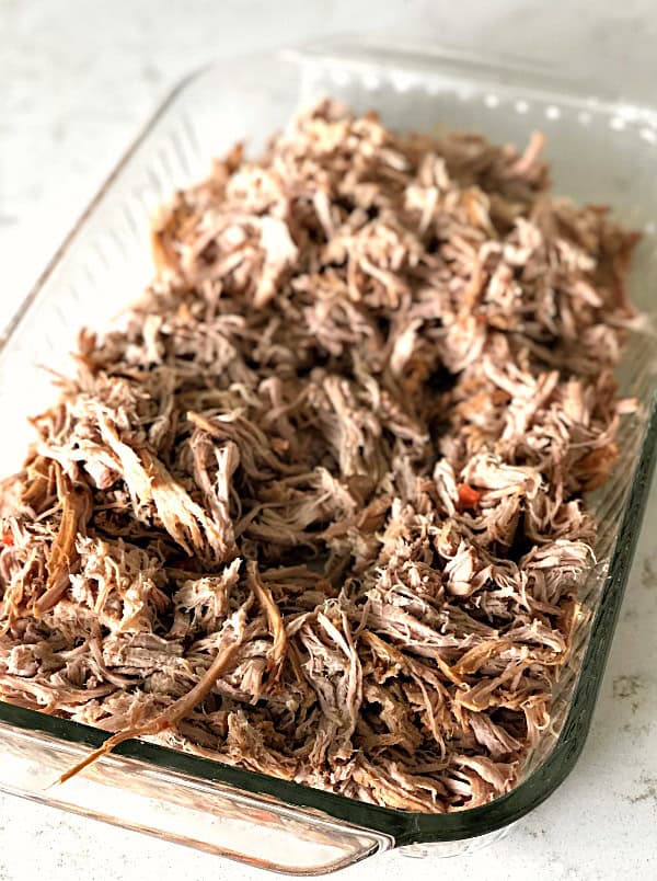 Shredded sweet pork in a 9x13 glass dish