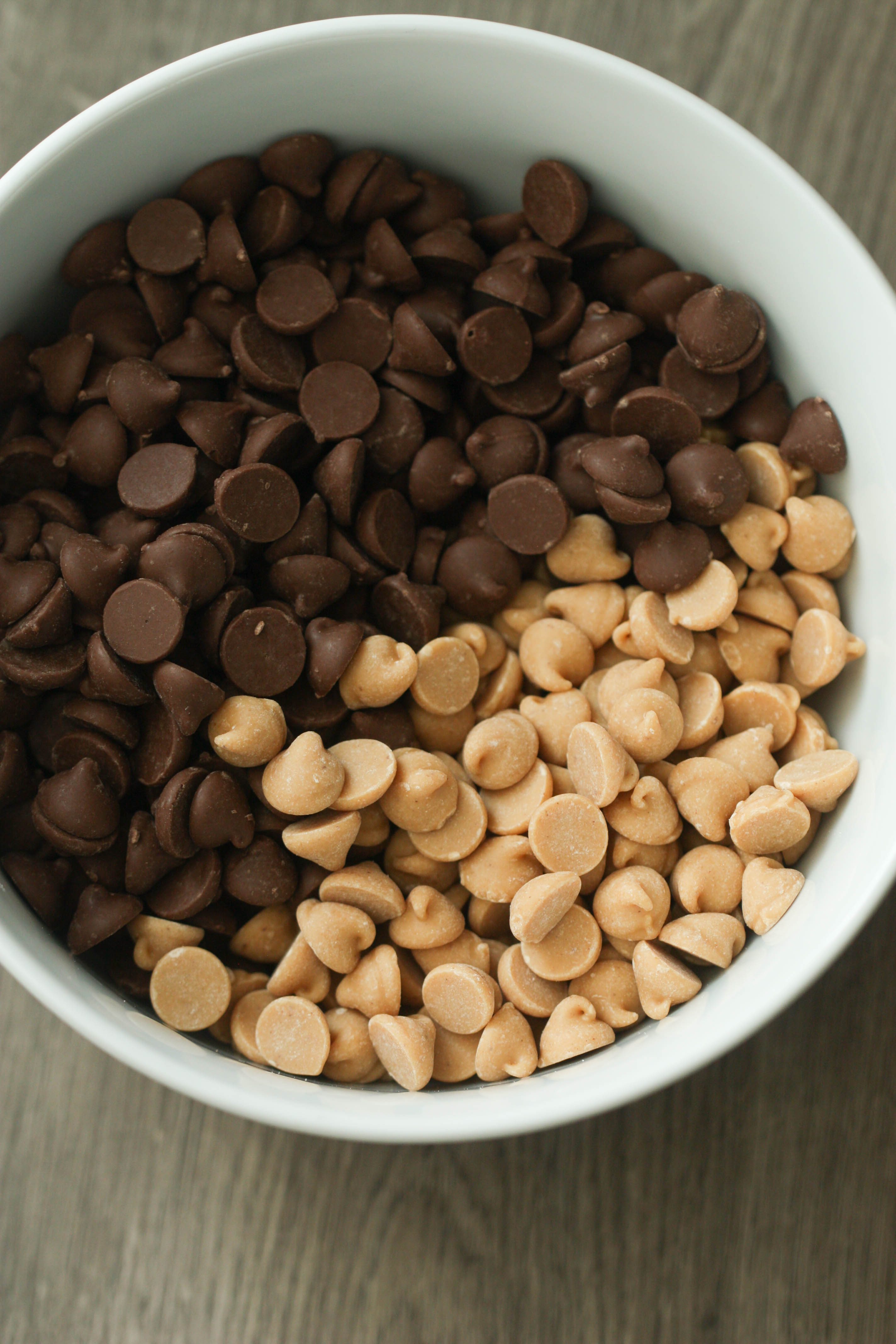 Peanut butter chips and chocolate chips in a microwave safe bowl