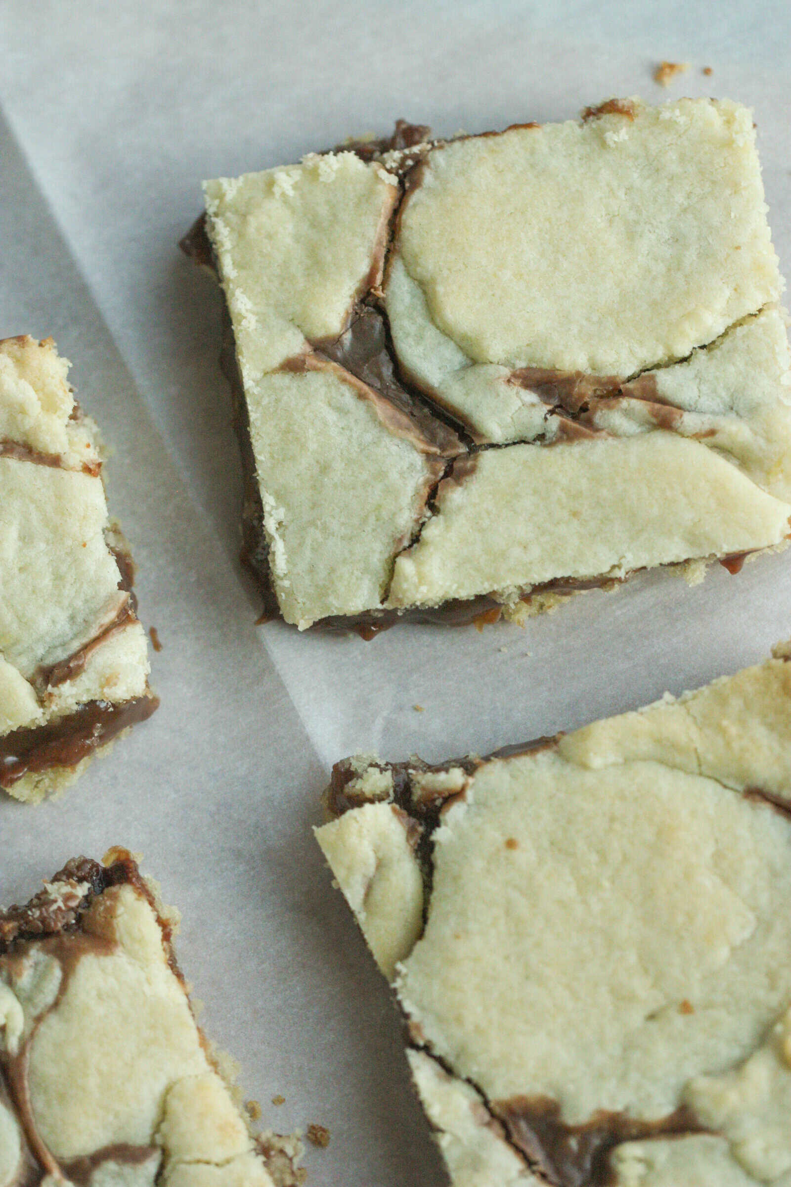 Cake Mix Cookie Bars sliced on parchment paper