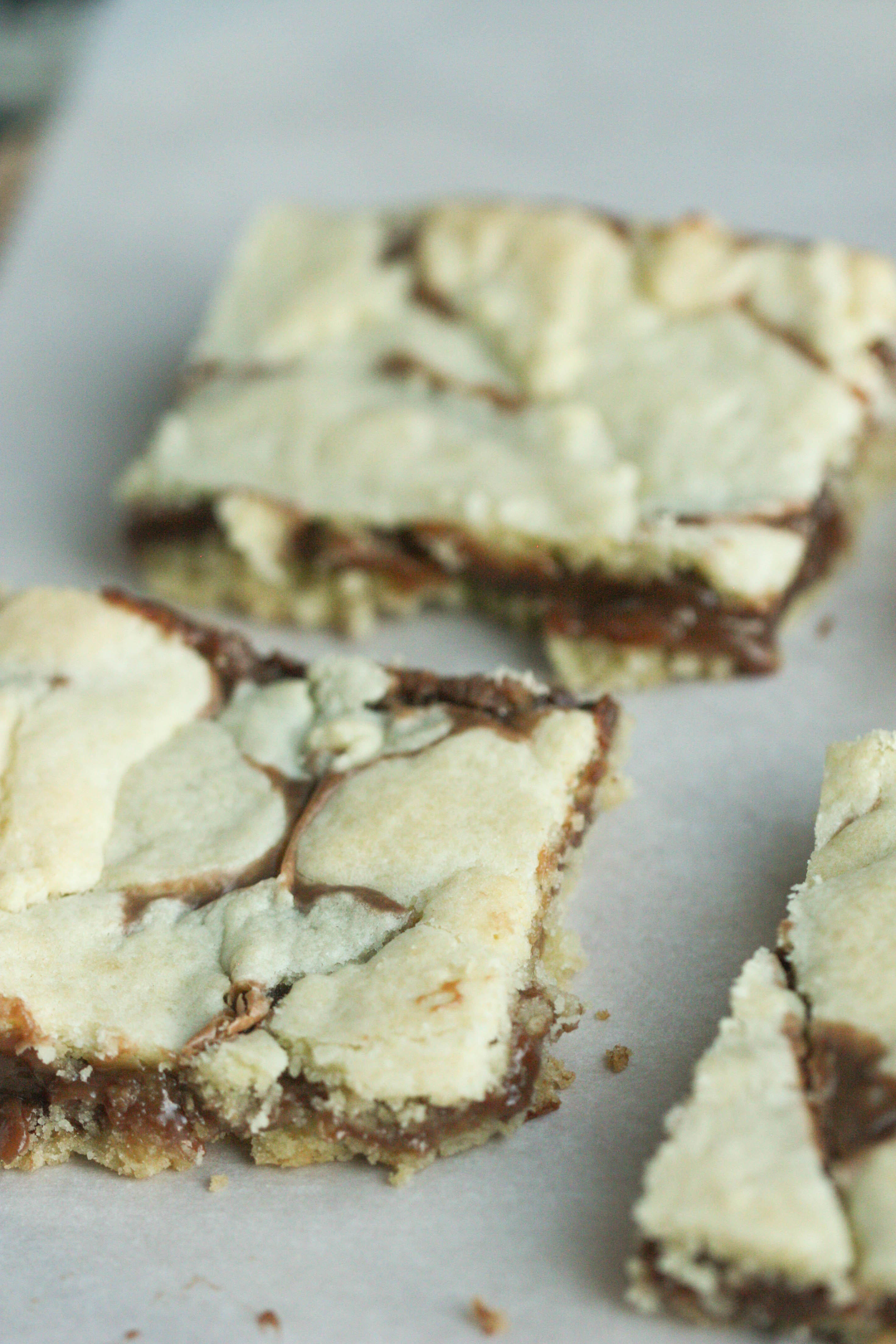 Cake Mix Cookie Bars sliced on parchment paper