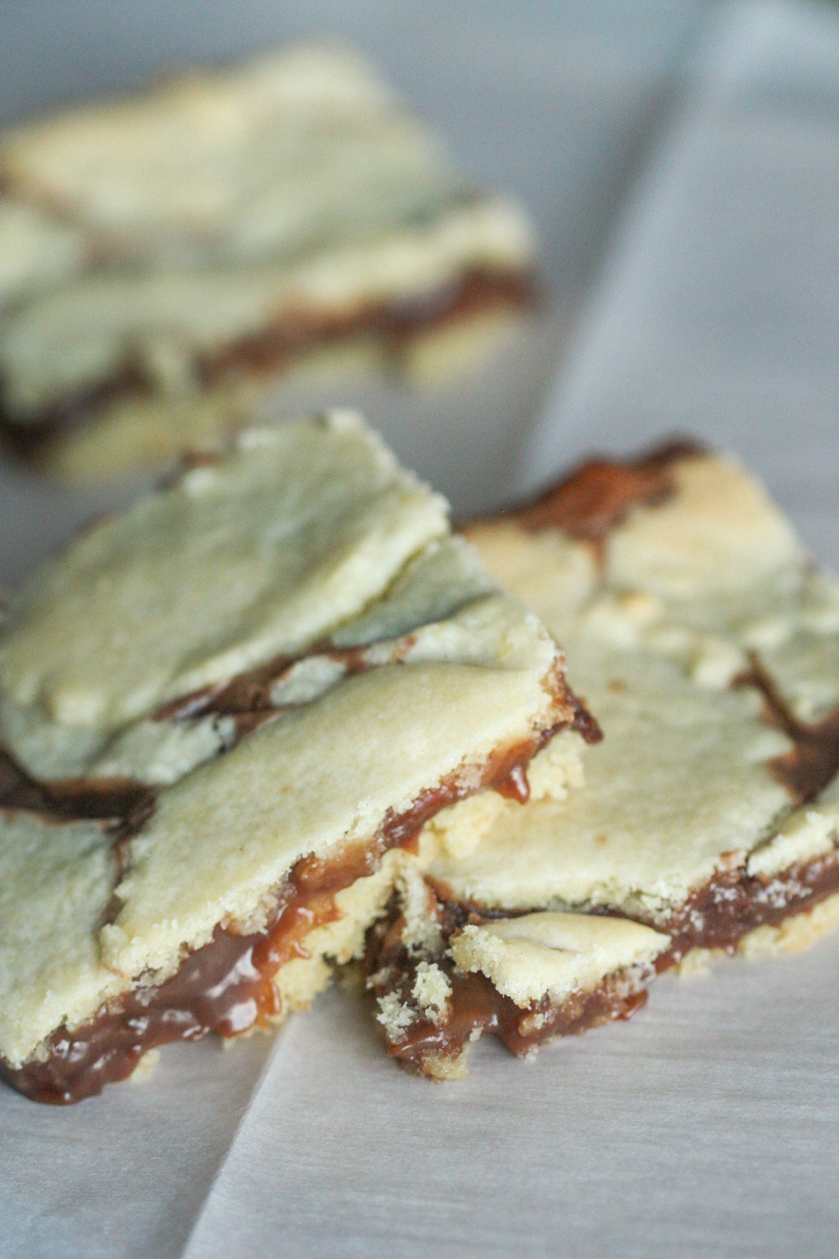 Cake Mix Cookie Bars stacked on parchment paper