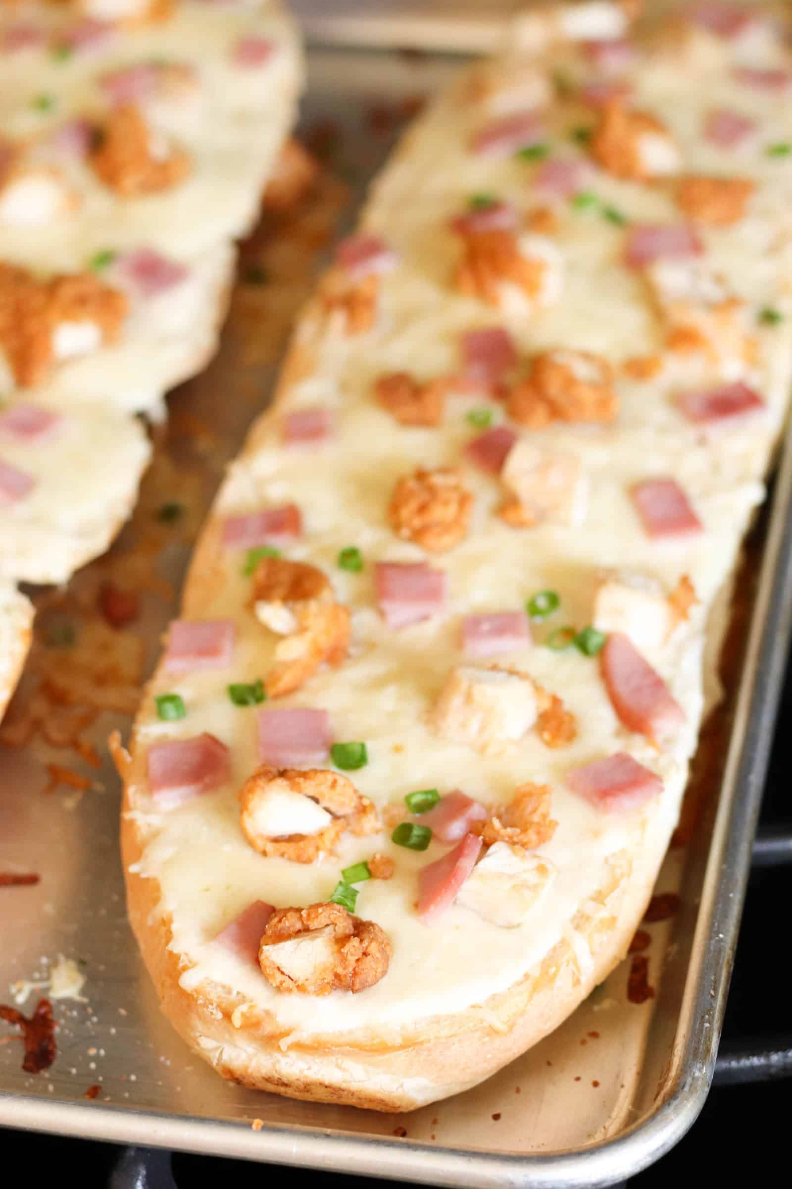 Chicken Cordon Bleu French Bread Pizza baked on a sheet pan