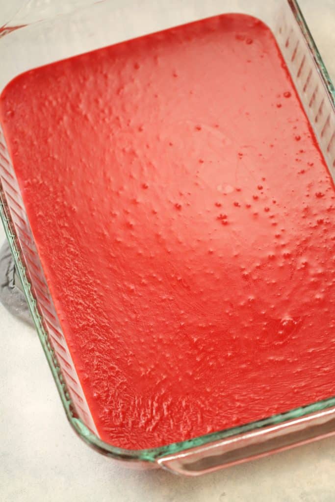 Cherry Sugar mixture spread into the bottom of a baking dish.