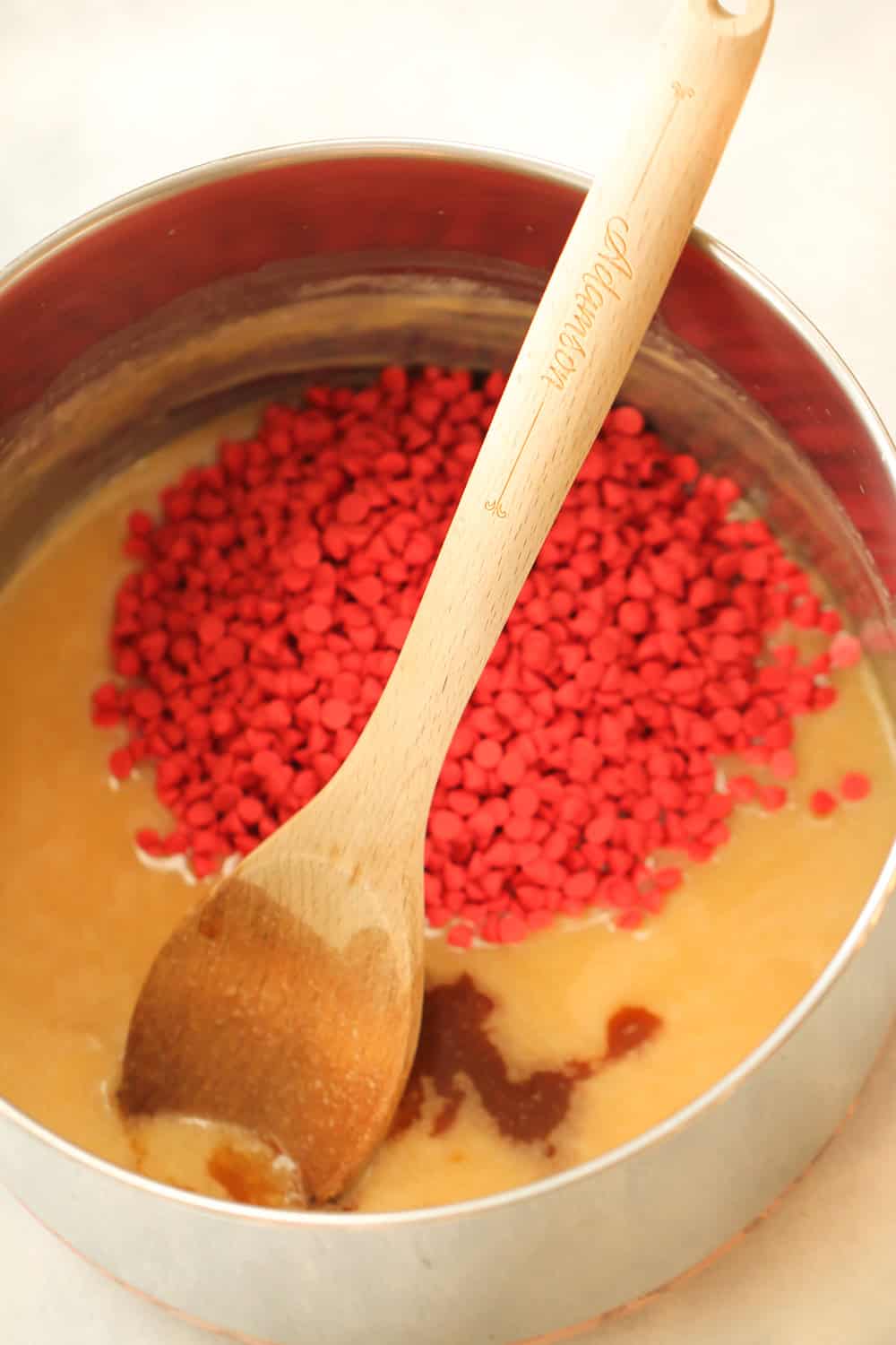 Cherry chips added to the sauce pan to be mixed in