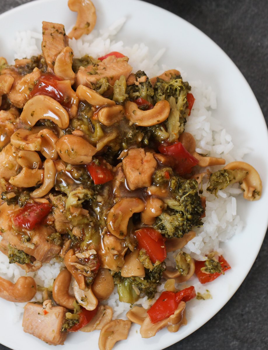 Top view of Instant Pot Cashew Chicken served over rice on a plate