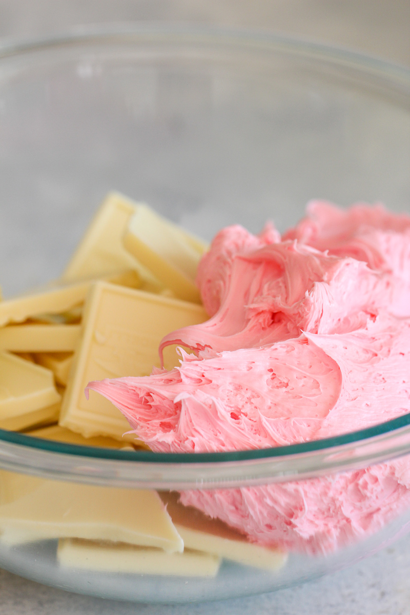 White chocolate bark and strawberry frosting in glass bowl