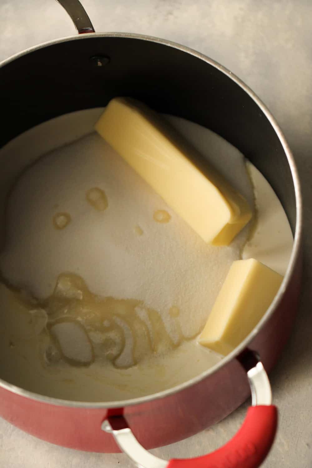 Butter and sugar melting in pan