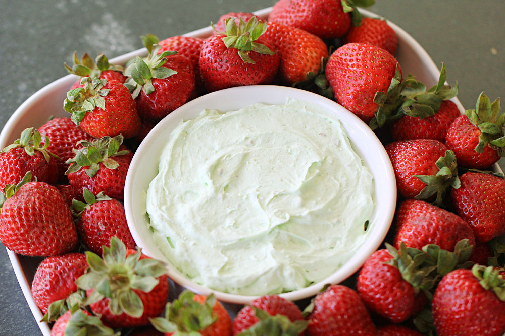 Pistachio Fruit Dip in a small bowl with strawberries