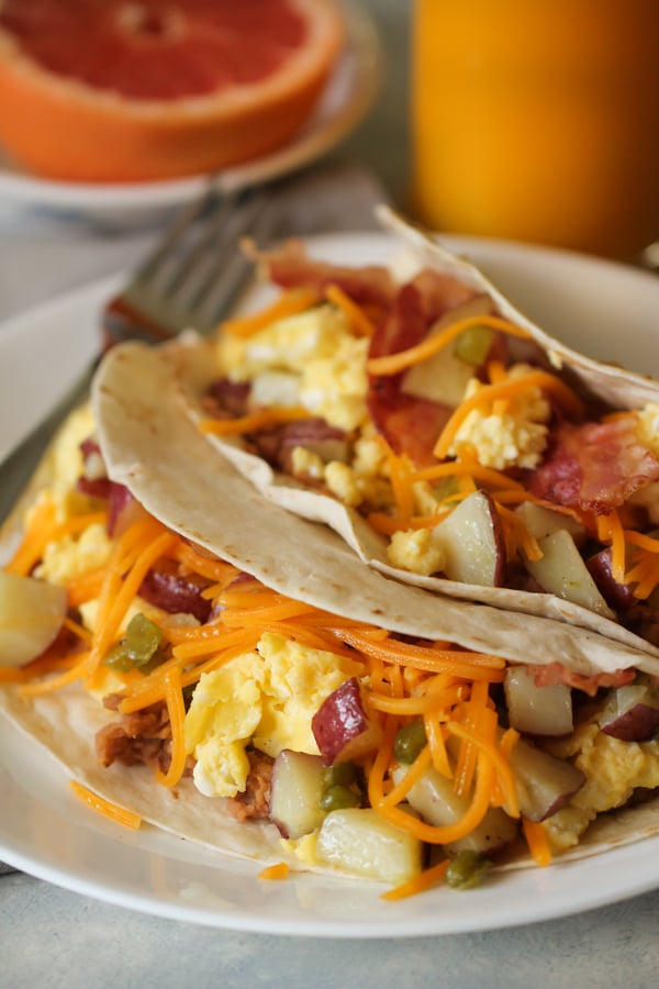 Breakfast Tacos on a plate with a fork