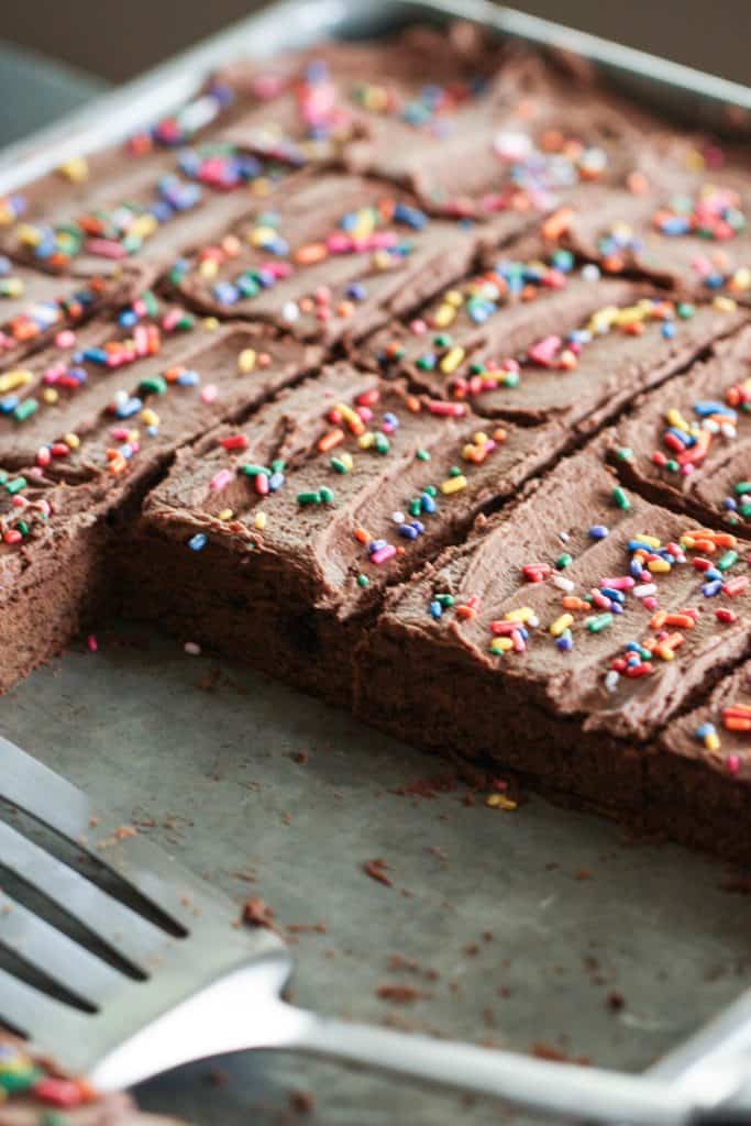 Chocolate Sugar Cookie Bars cut into squares on a pan with some missing.