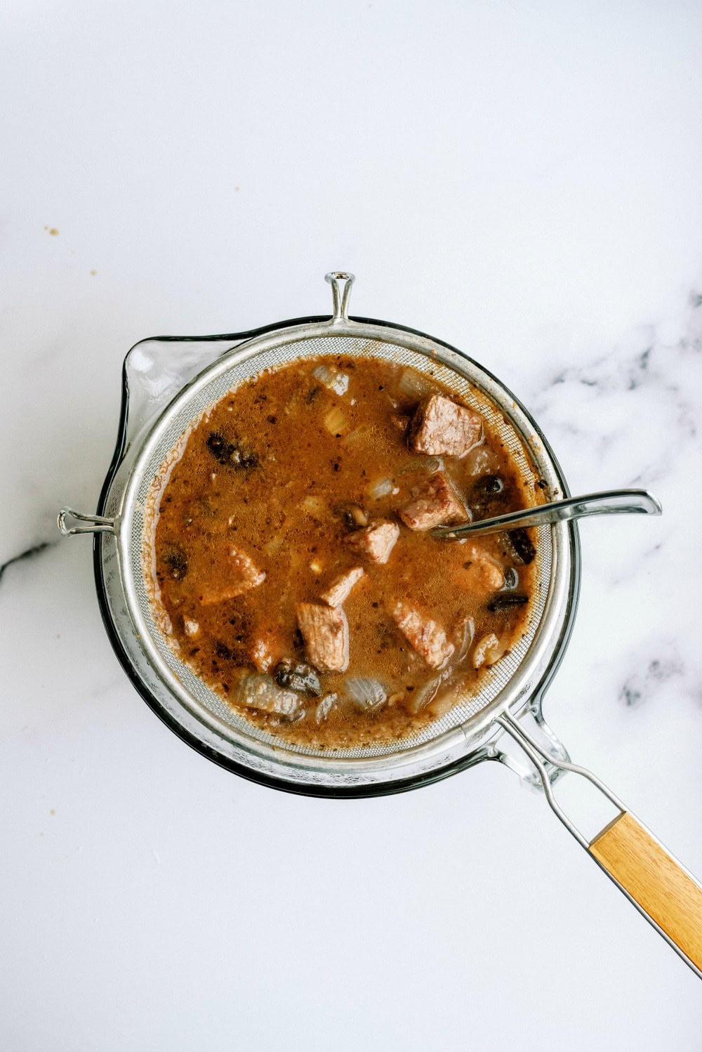 Strainer with beef tips and drippings