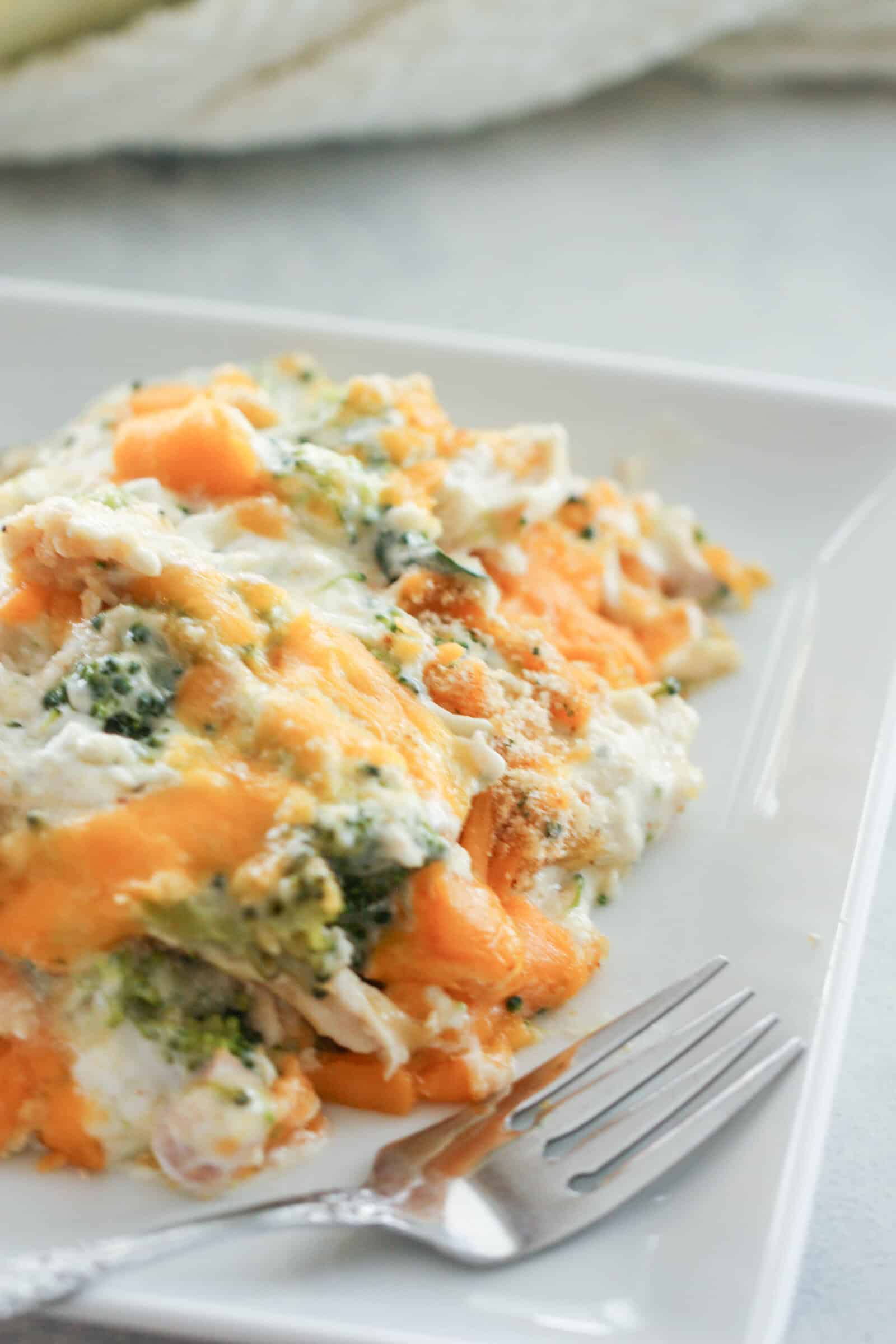 A serving of Easy Chicken and Broccoli Casserole on a plate with a fork.