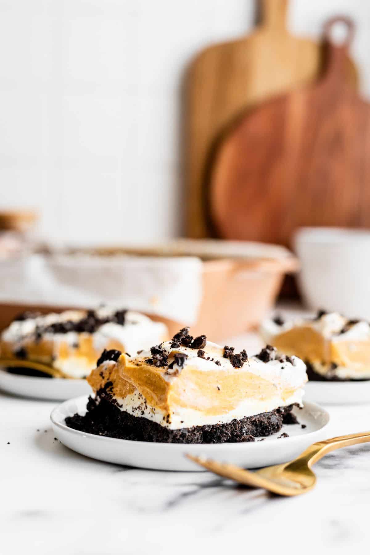 Slices of Oreo Pumpkin Delight on plates