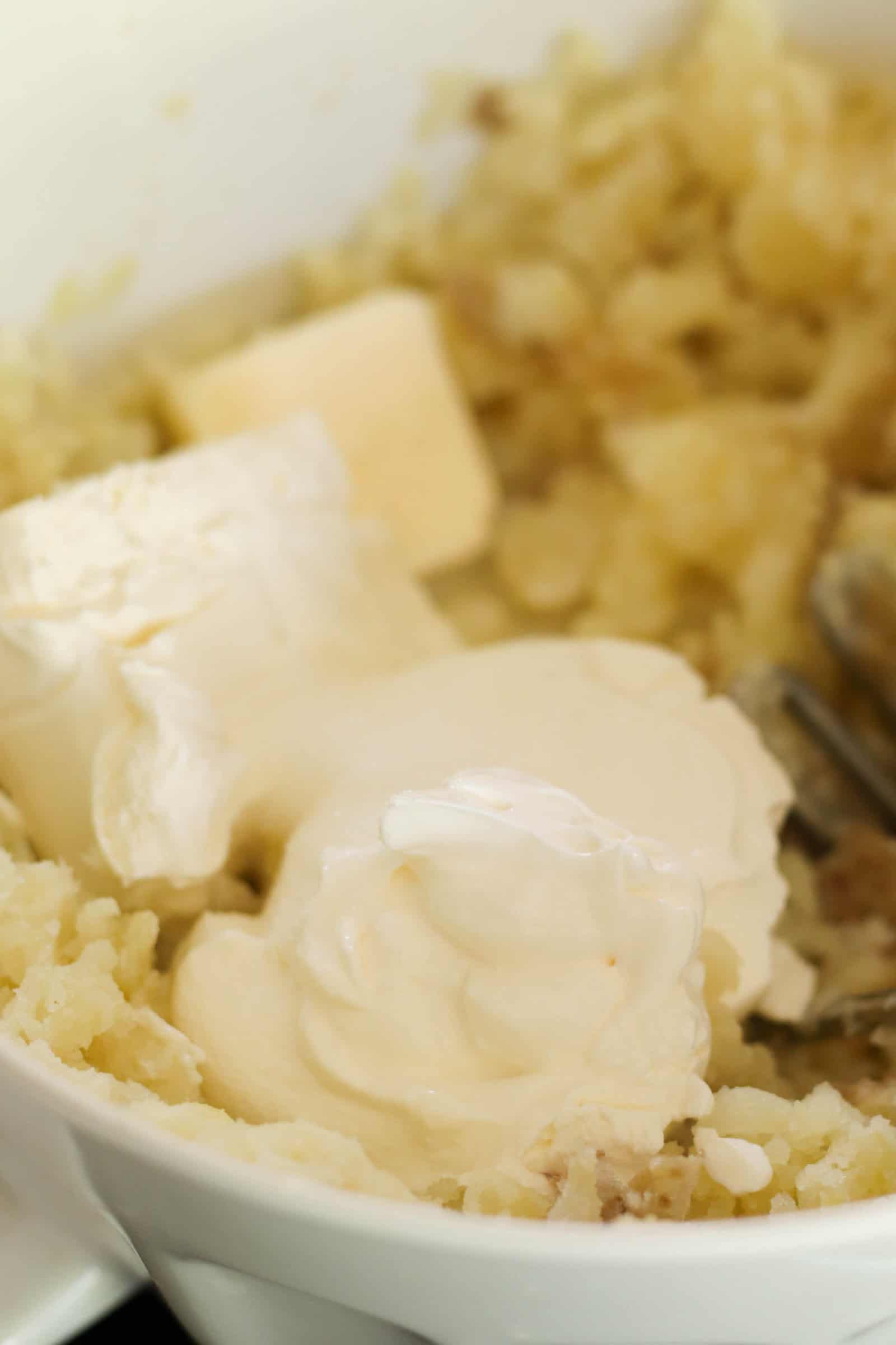 Butter added to cooked potatoes