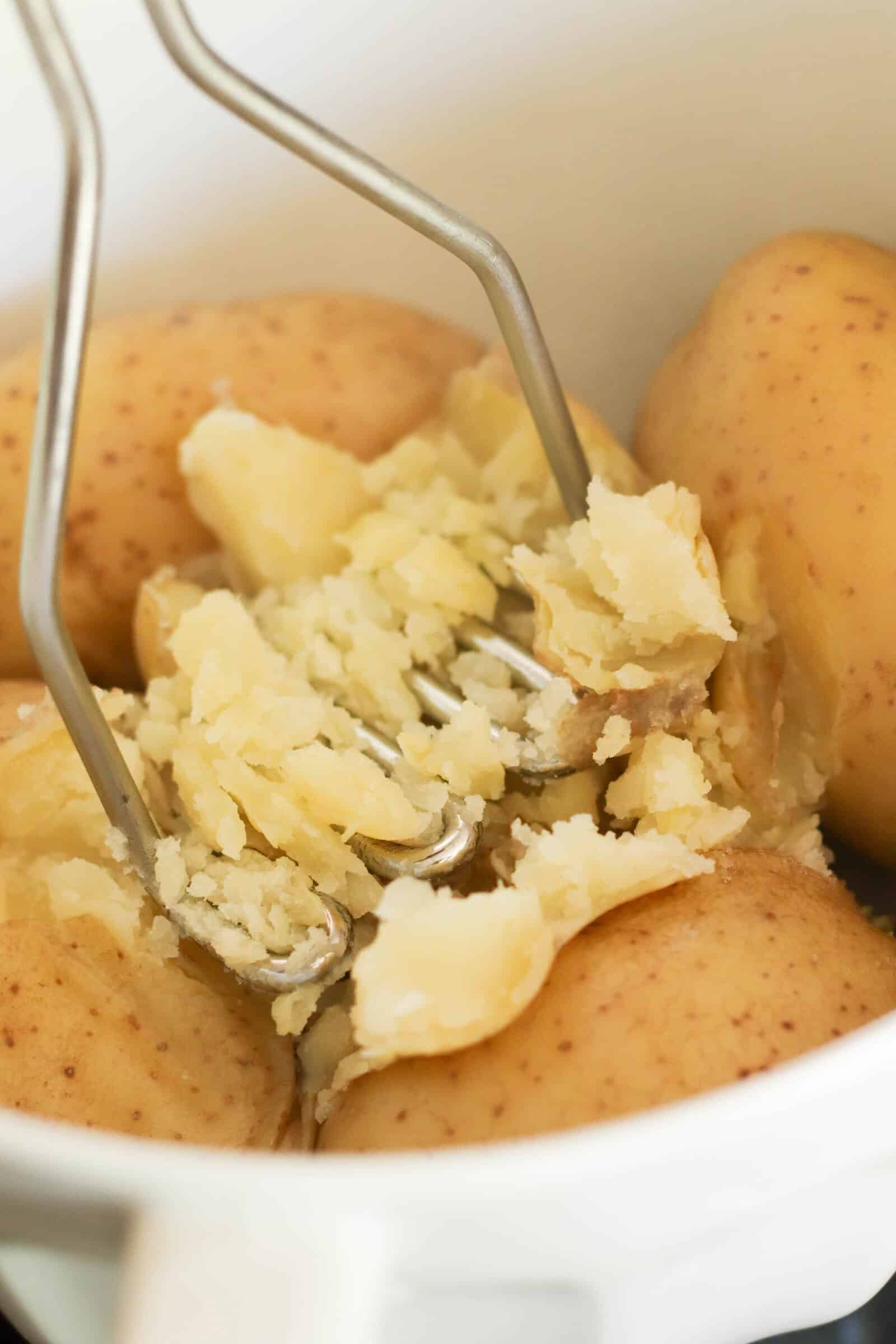 Mashing cooked potatoes