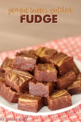 A plate of square chocolate brownies with a marbled pattern, featuring chocolate and caramel swirls.