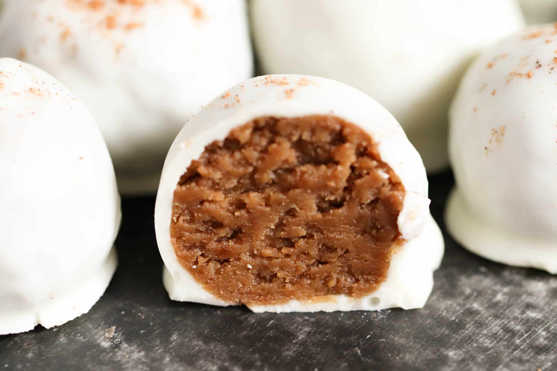 The soft inside of a gingerbread truffle after it has been cut in half.