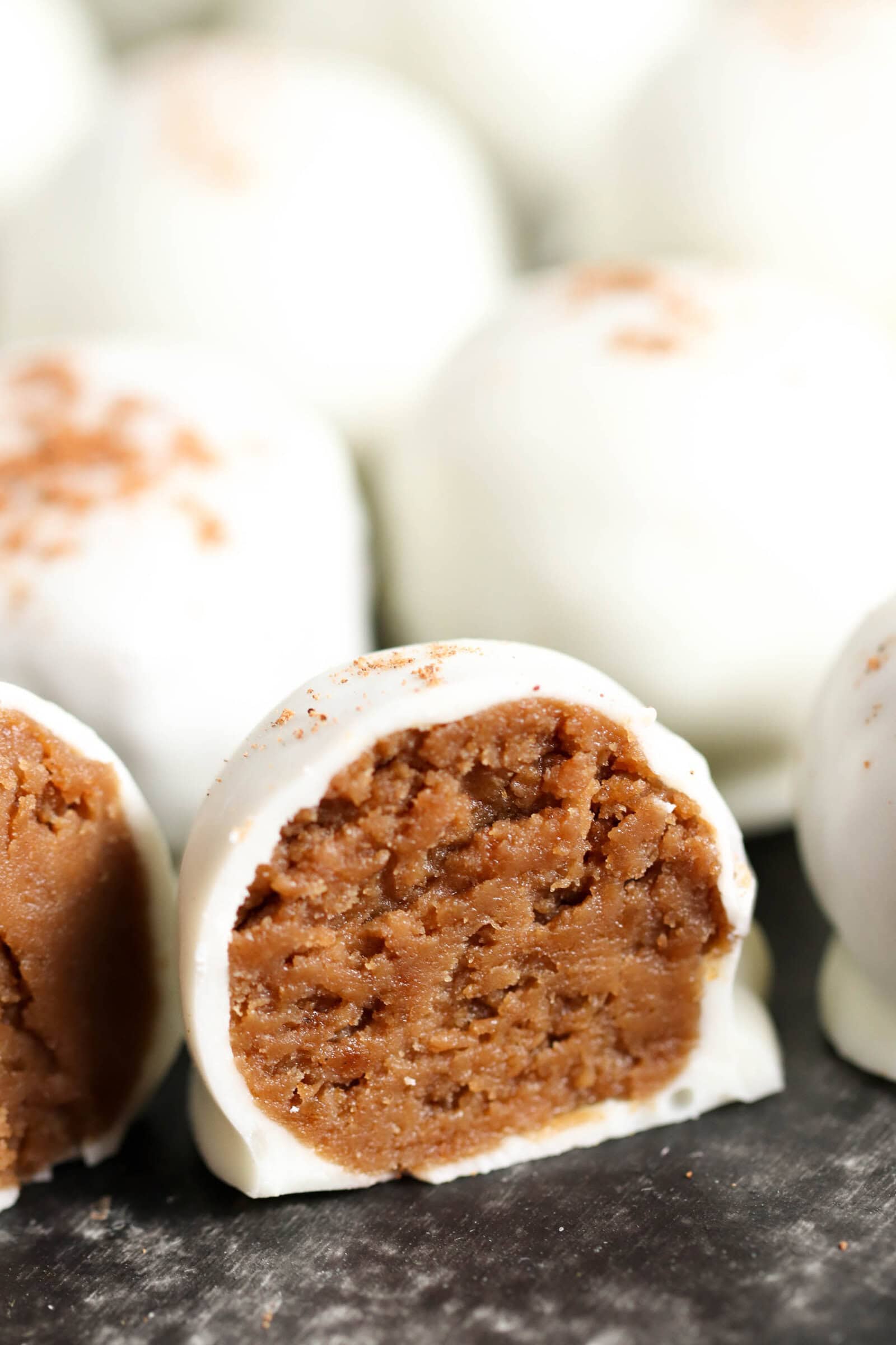 Gingerbread truffles cut in half to show the soft cookie inside.