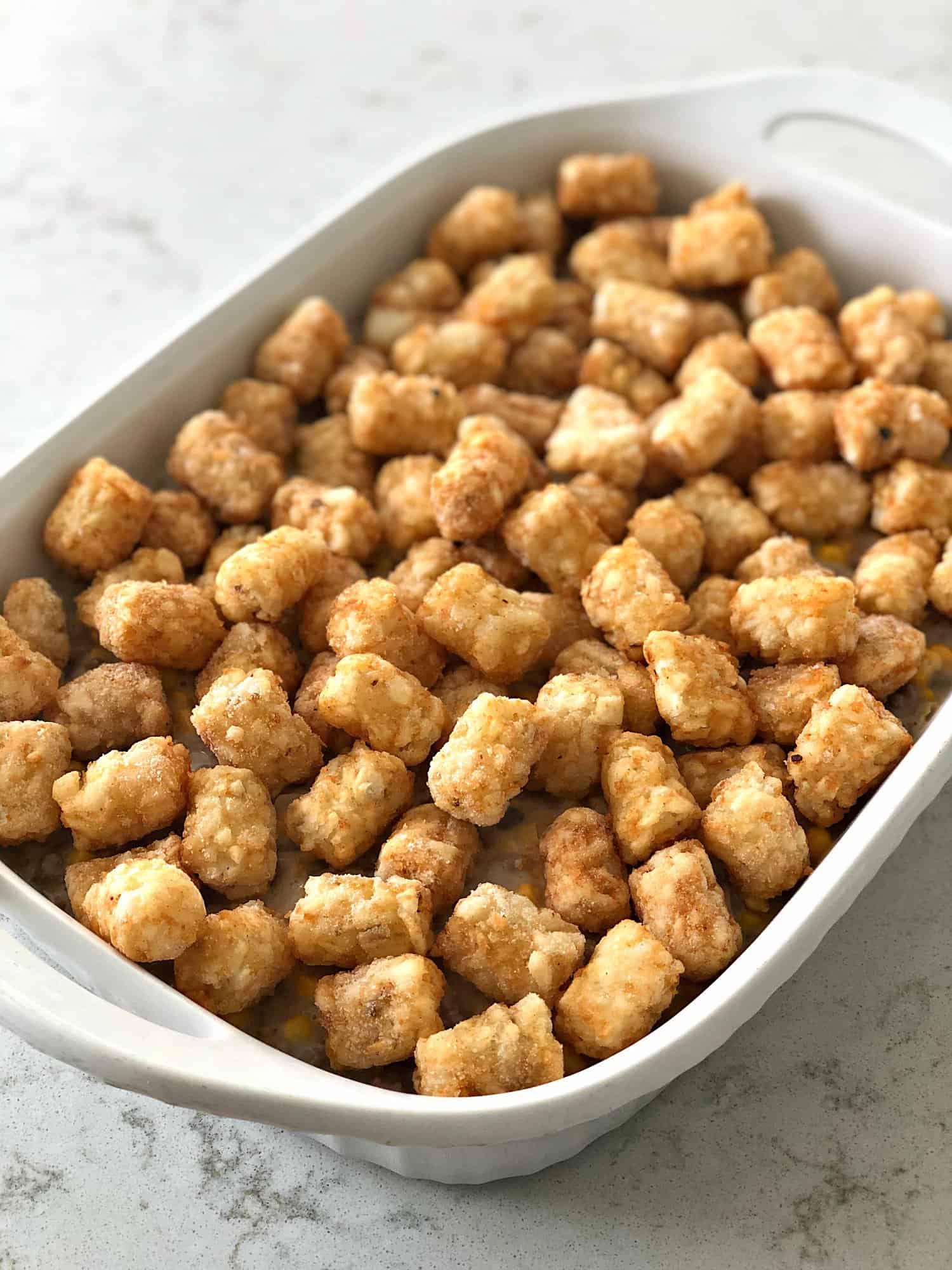 tater tots in a 9x13 pan for tater tot casserole