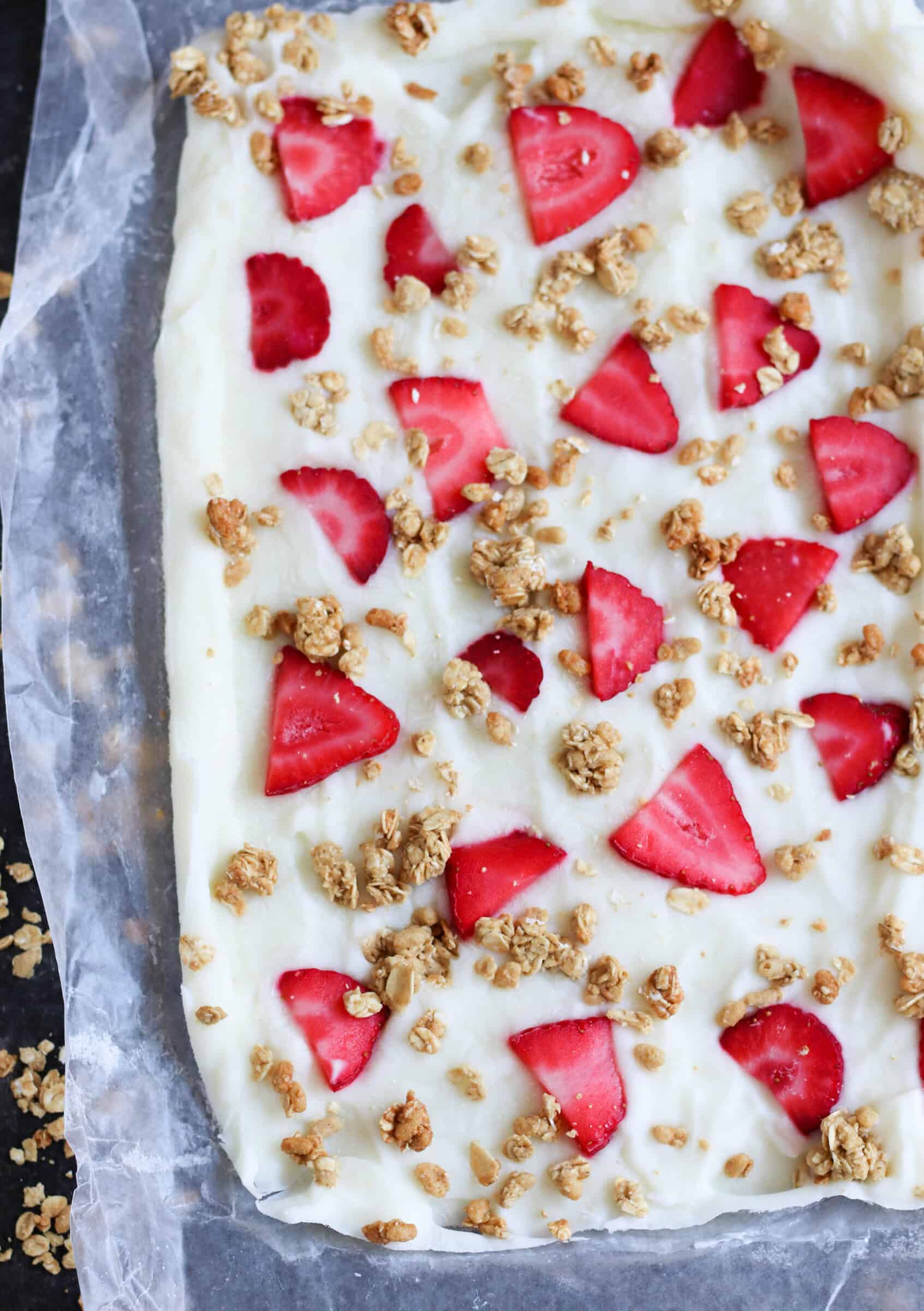 Strawberry Yogurt Granola Bark spread out in 9x13 pan