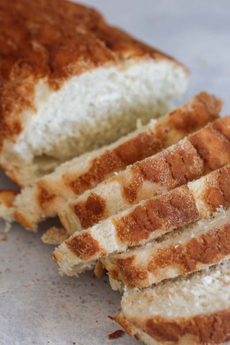 Sliced french bread on a cutting board