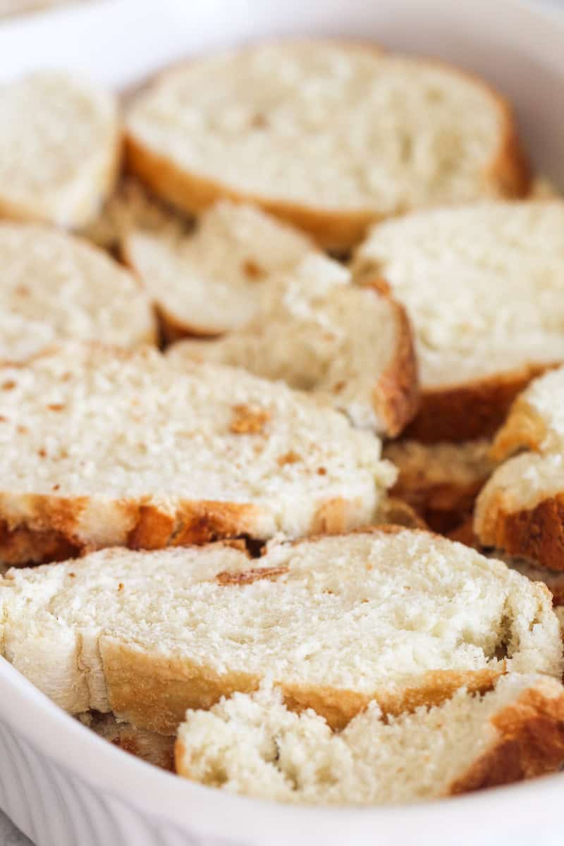 Slices of french bread in a baking dish