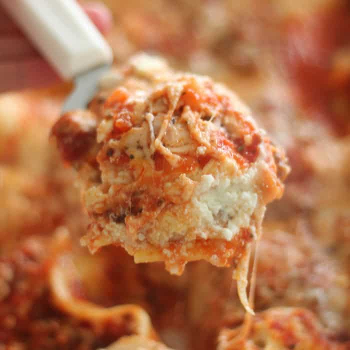 Easy and delicious homemade lasagna from SixSistersStuff.com Cheesy lasagna bite made from easy lasagna recipe