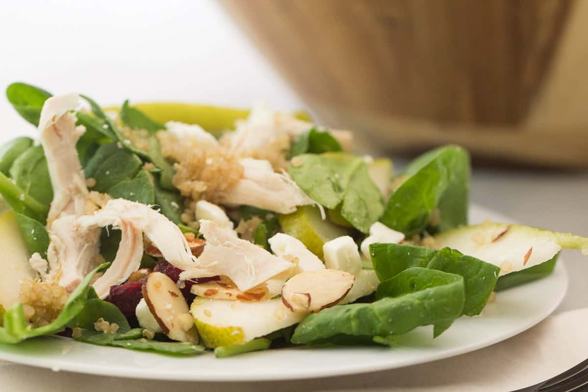 chicken and quinoa green salad on a plate