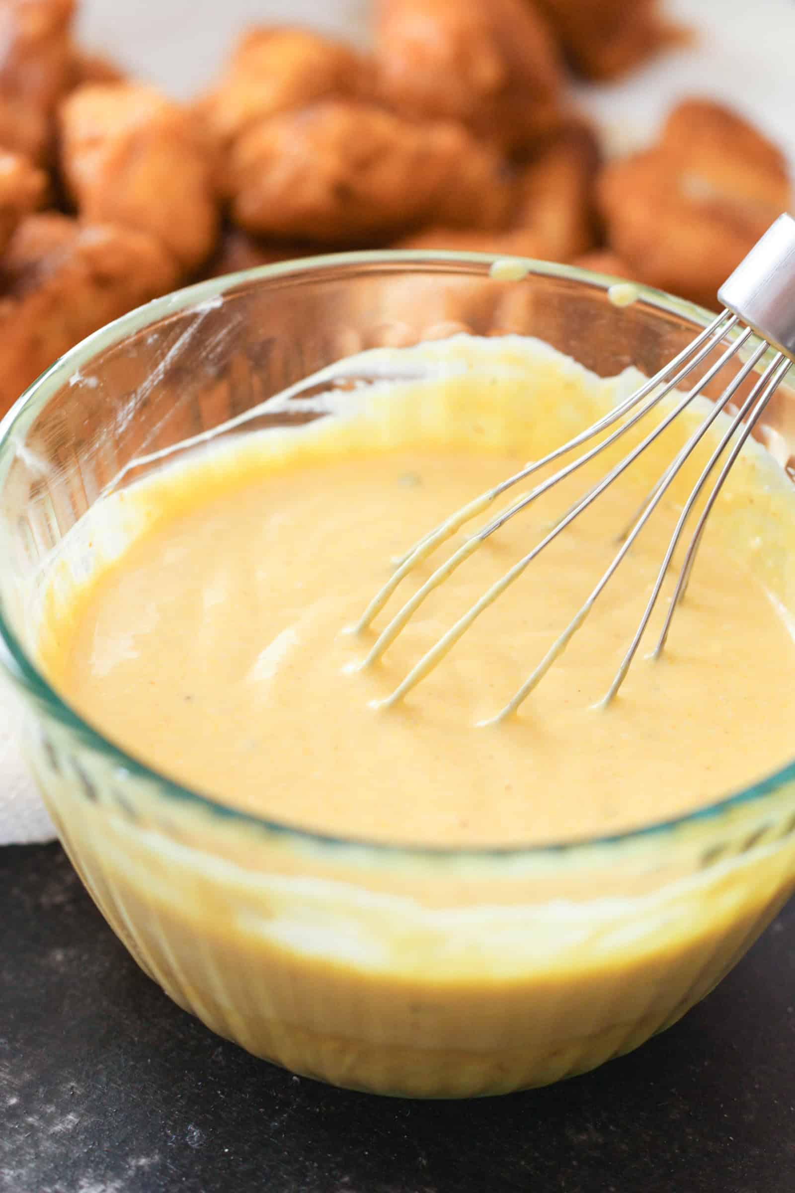 Ingredients for Homemade Chick-Fil-A Sauce whisked together in a bowl