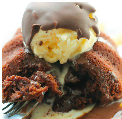 Copycat Chili’s Molten Lava Cake topped with a scoop of ice cream and chocolate sauce