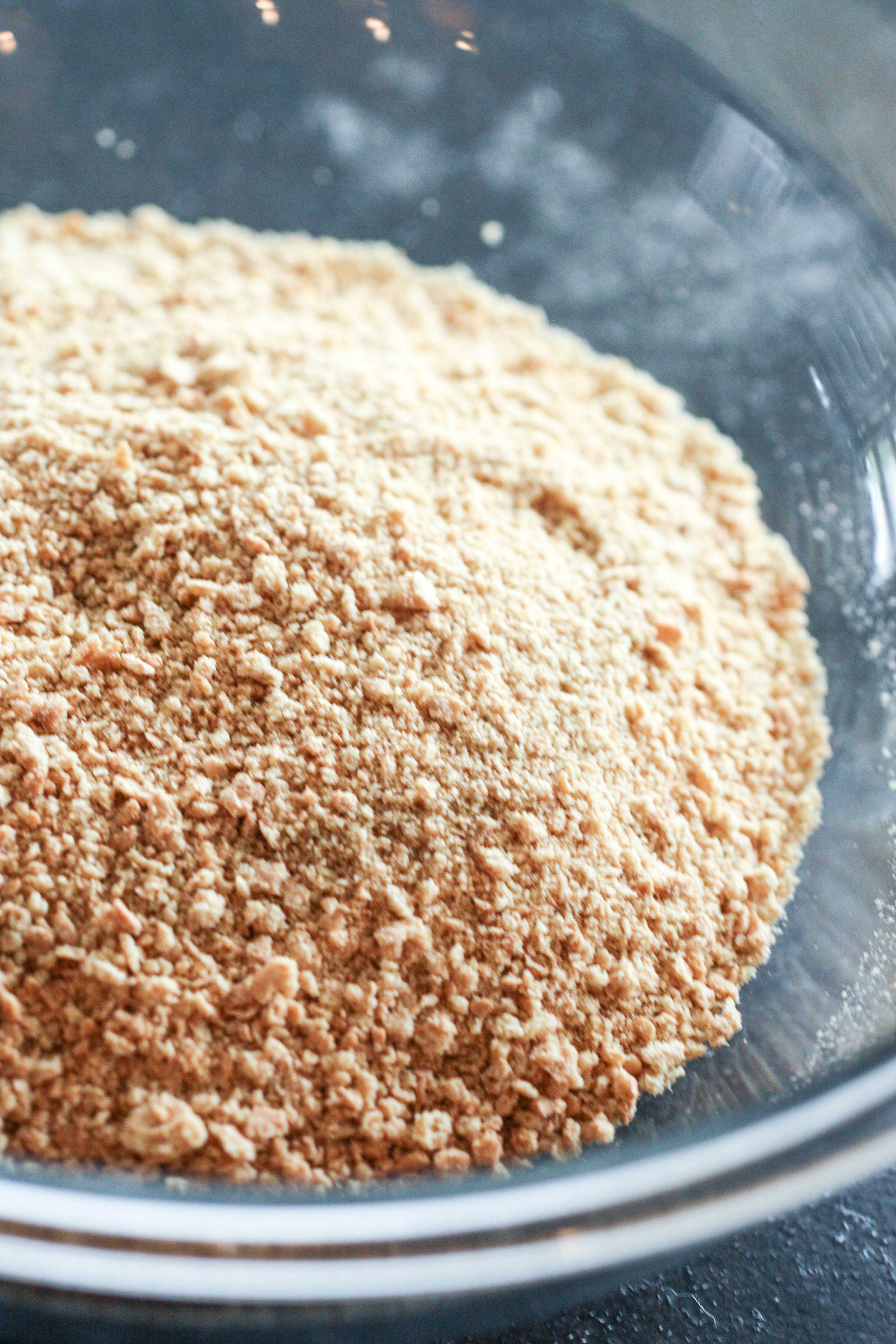 Graham cracker crumbs in a mixing bowl
