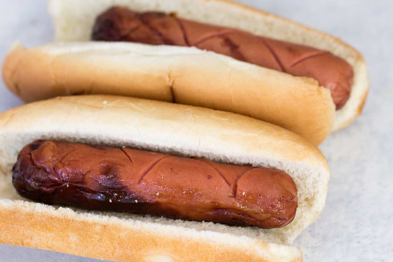 Grilled hot dogs in buns