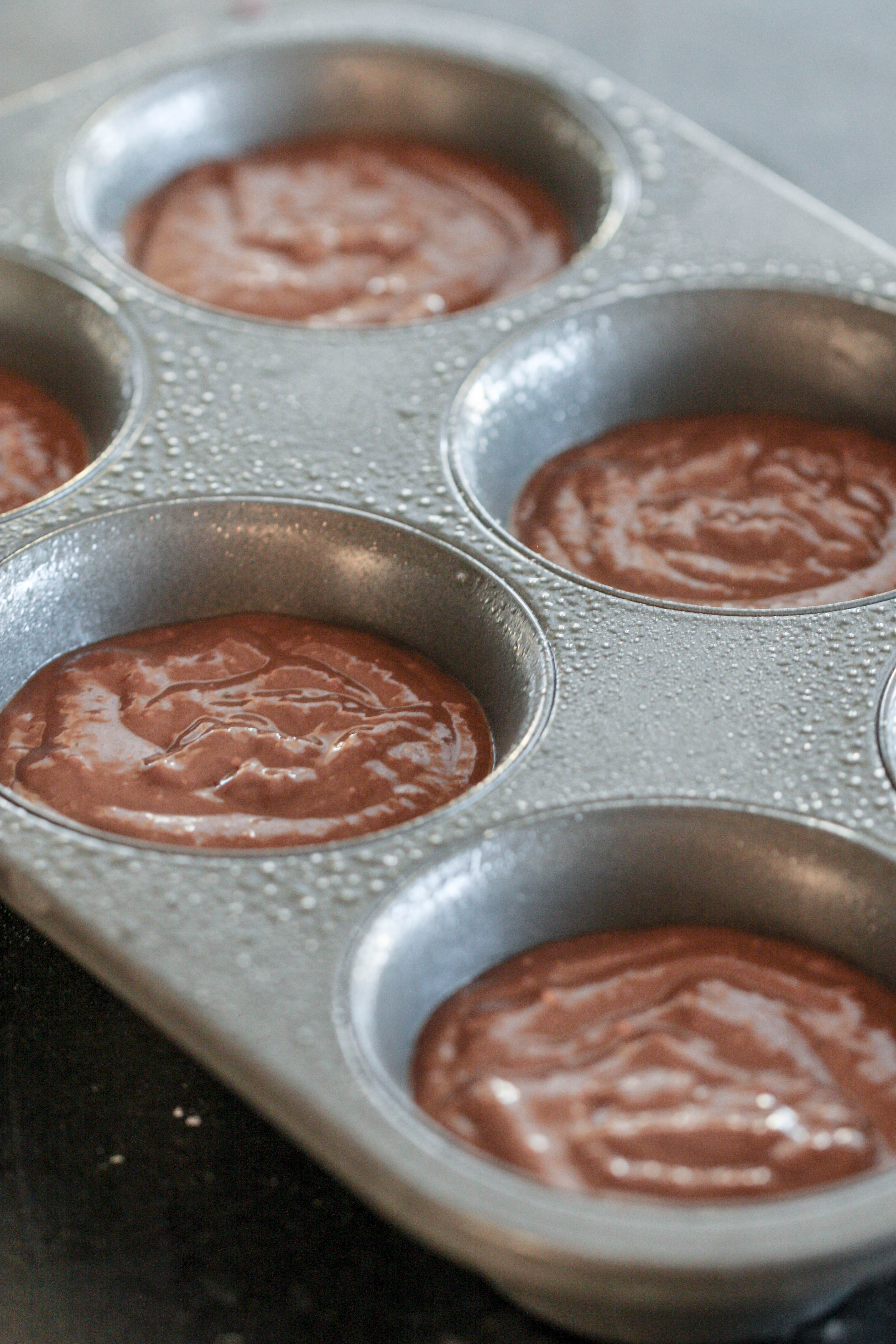 Chocolate Banana Blender Muffin batter in muffin pan