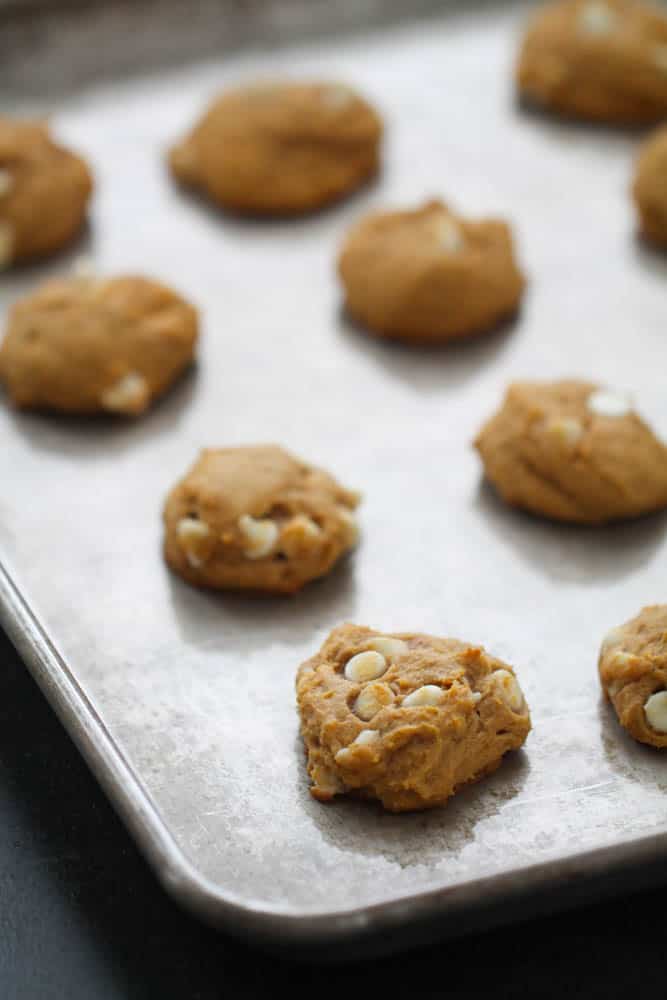 White Chocolate Cheesecake Pumpkin Cookies on a baking sheet