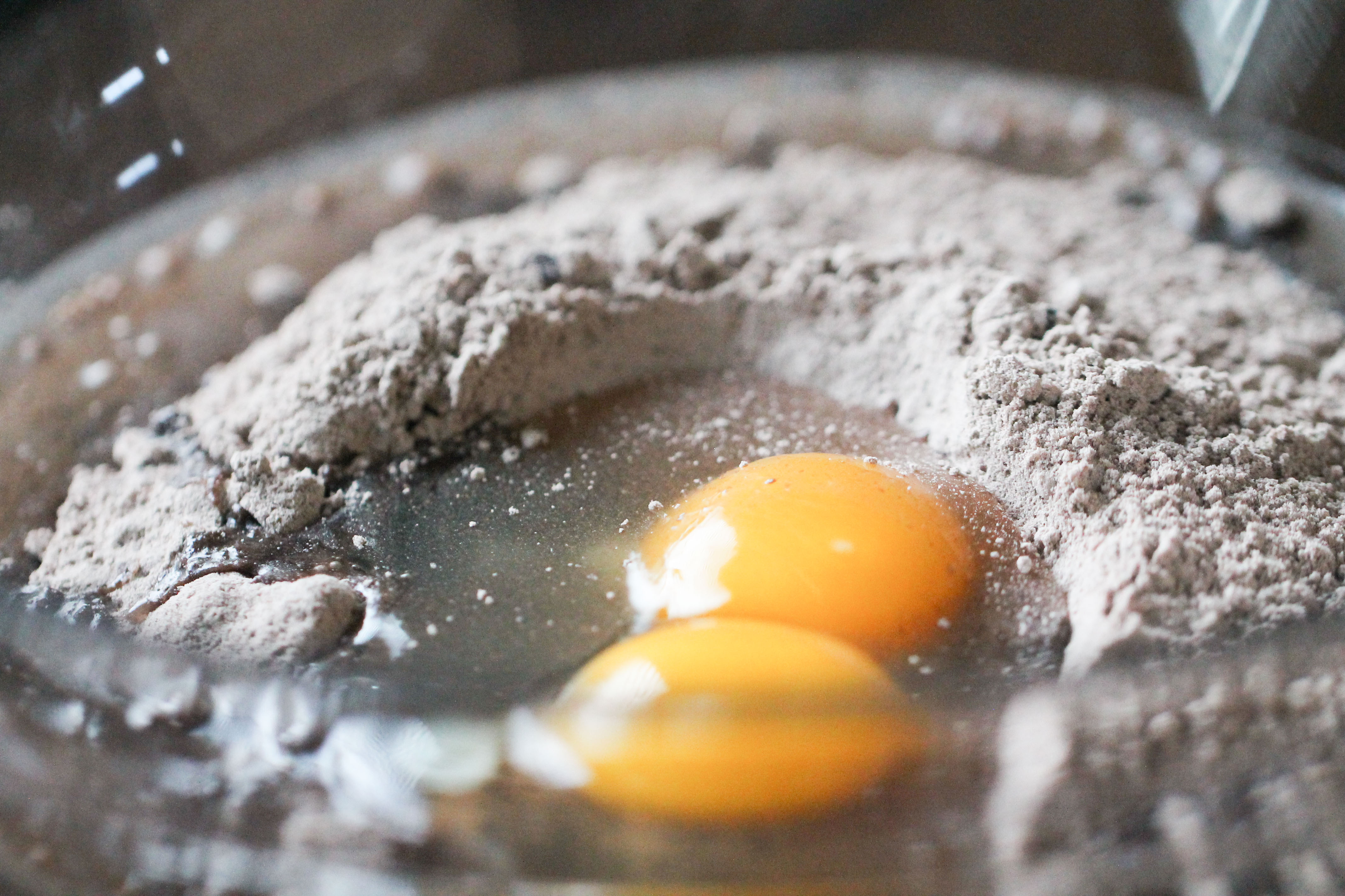 dry cake mix and eggs in a mixing bowl