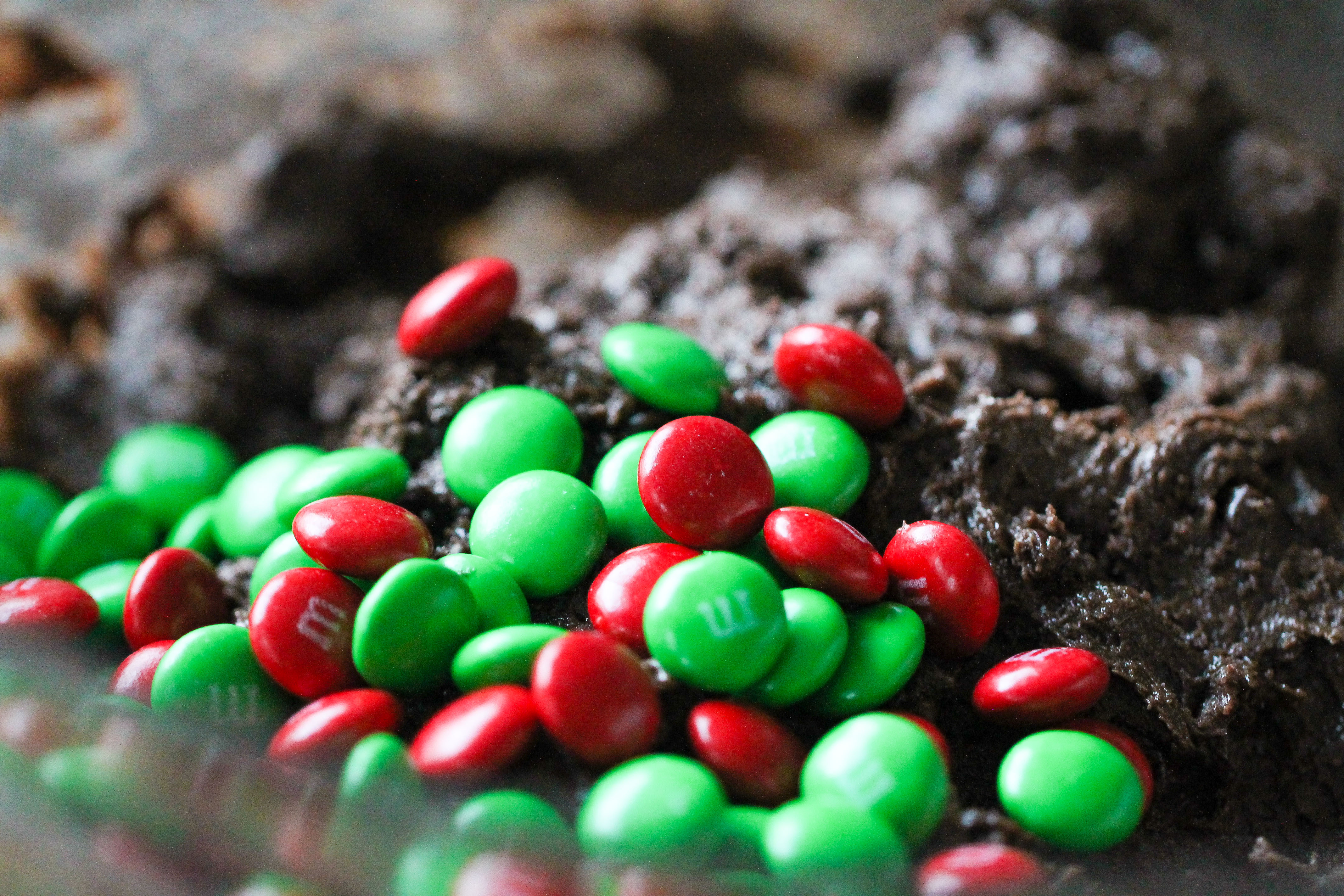 M&M's getting mixed into cake cookie dough